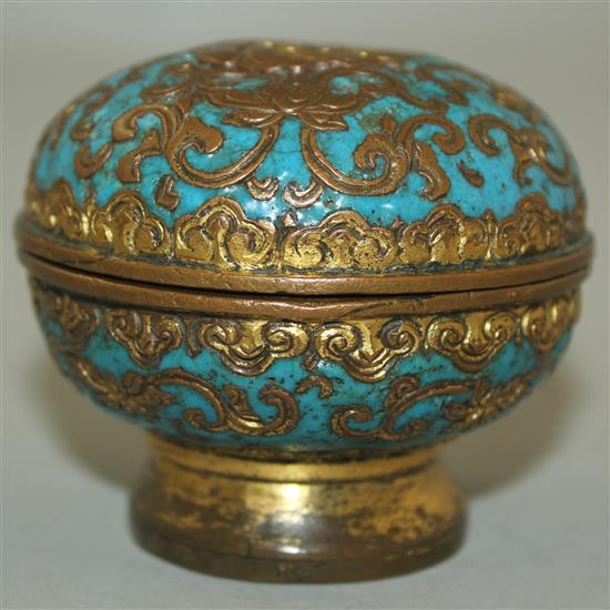 A Chinese gilt bronze and champleve enamel box and cover, 18th century, diam. 6.5cm, wear and minor losses